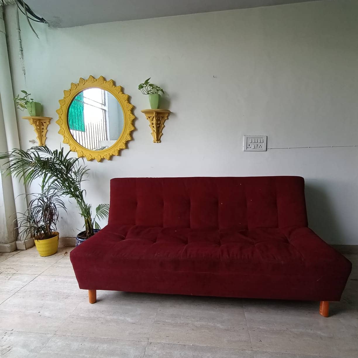 Indian girls sitting in a clean PG room in North Delhi